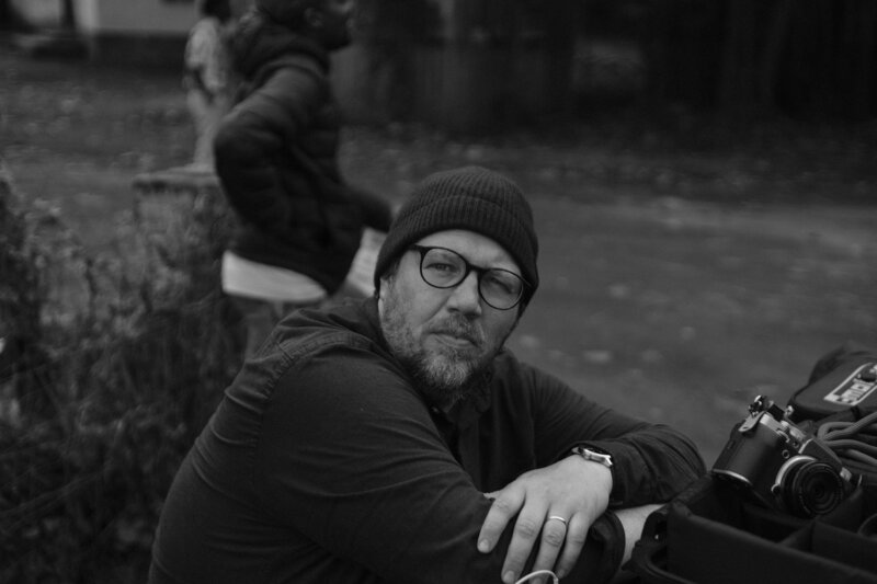 Portrait of Stephan Burchardt, Director of Photography, on set capturing visuals for film and TV productions.