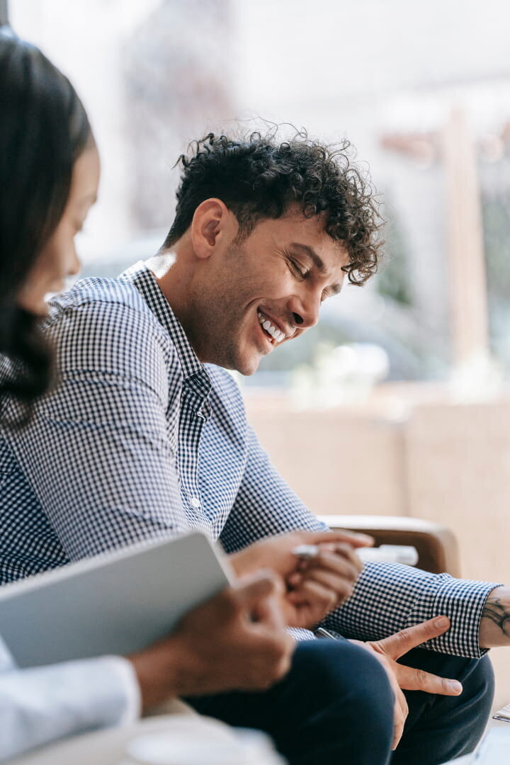 a man smiling in therapy