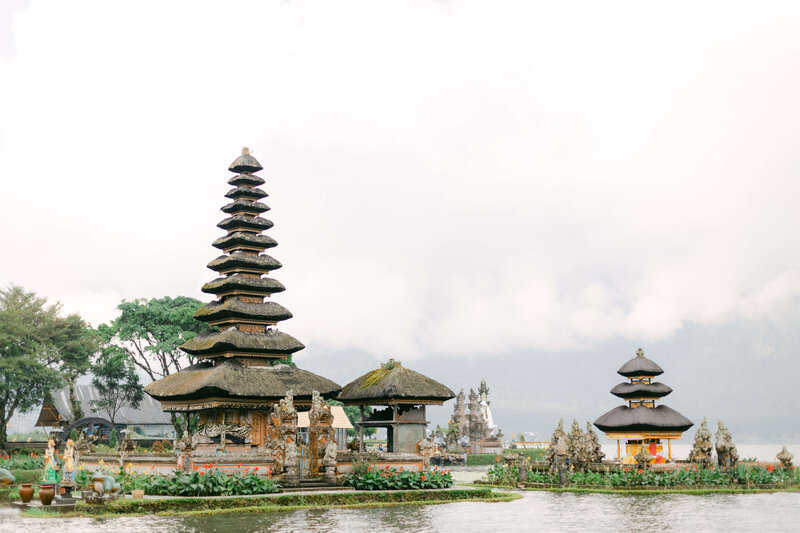 Temples in Bali under a tense fog.