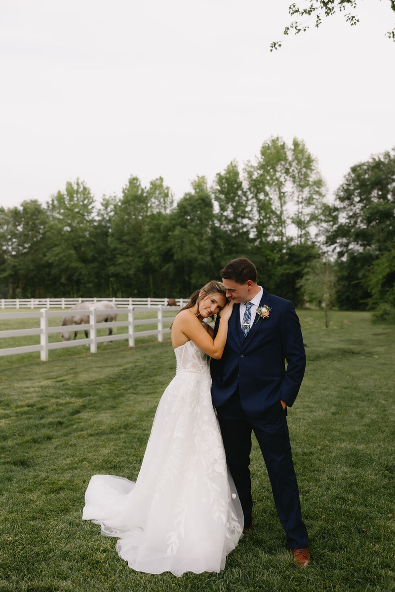 Bride and groom in an outdoor setting having a romantic photo