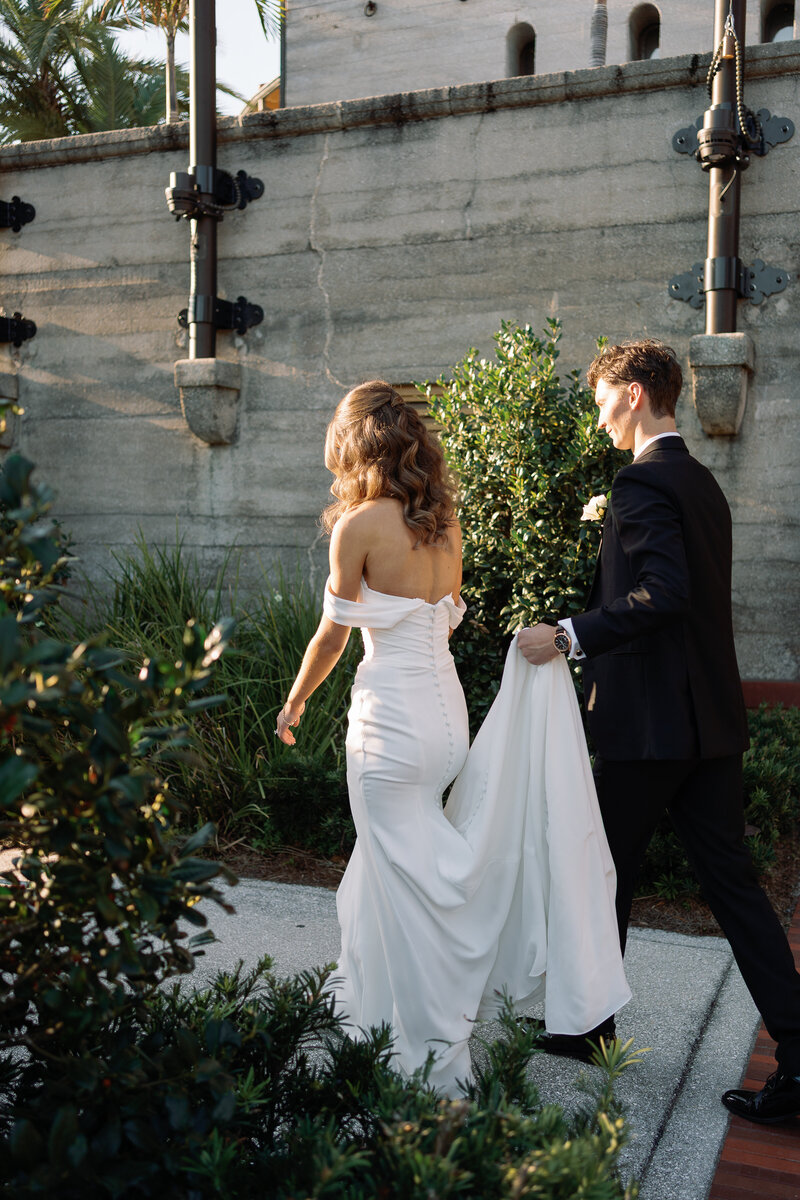Bride and groom walking together taken by jacksonville wedding photographer, Shelby Ann Photos