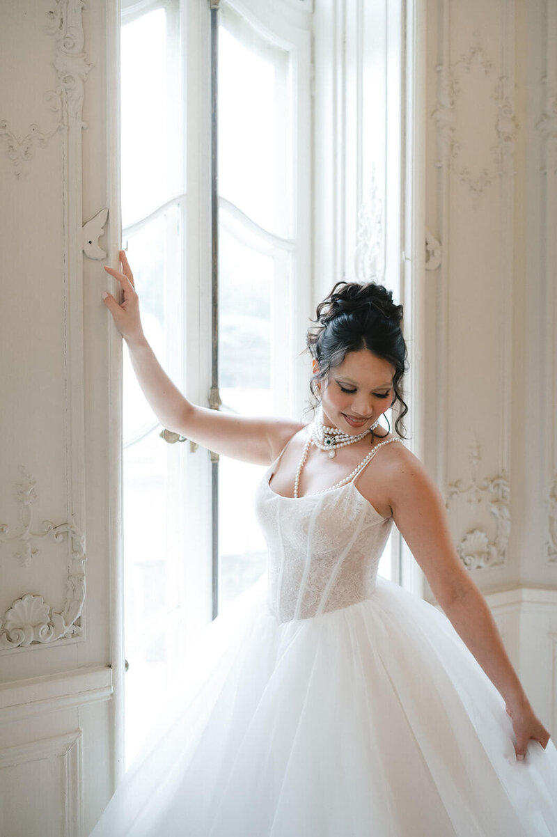 Bride in a sexy fairytale ballgown with a curly updo and cascading ringlets — romantic bridal hair by Klover Beauty for a Maryland wedding.