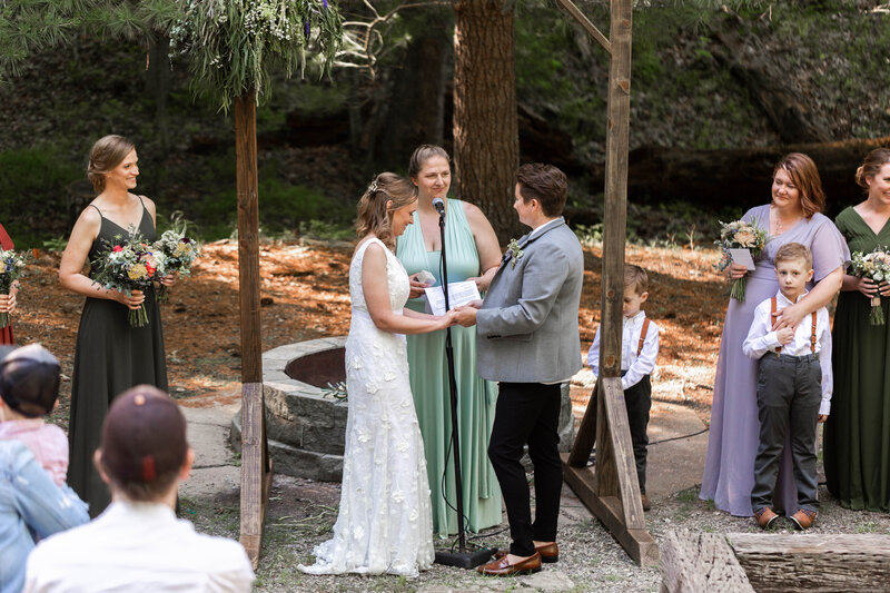 Emotional 'I Do' moment captured by Style & Grace Photography in Eureka, MO, showcasing the love and commitment between the newlywed couple as they exchange vows.