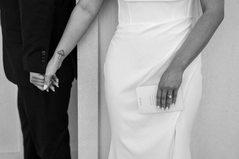 black and white image of couple during first touch