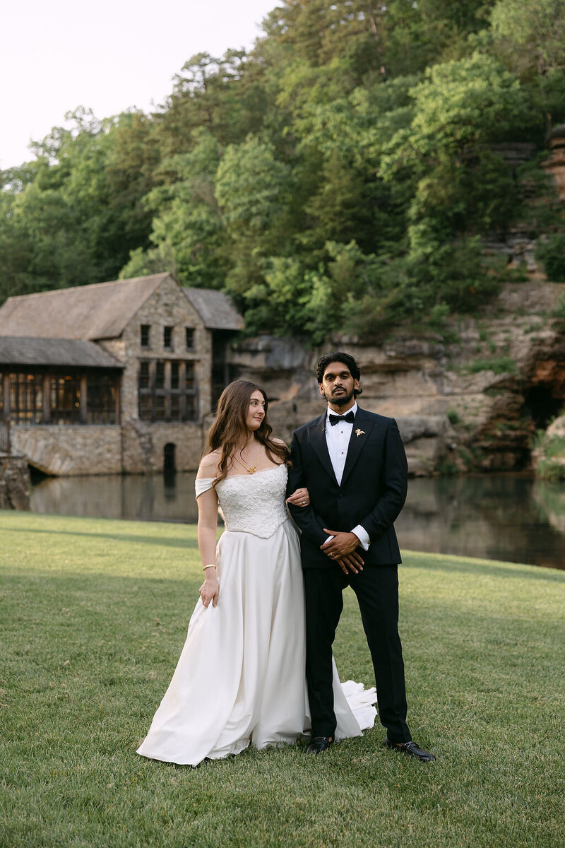 Bride and Groom in front of Venue at Dogwood Canyon in Missouri