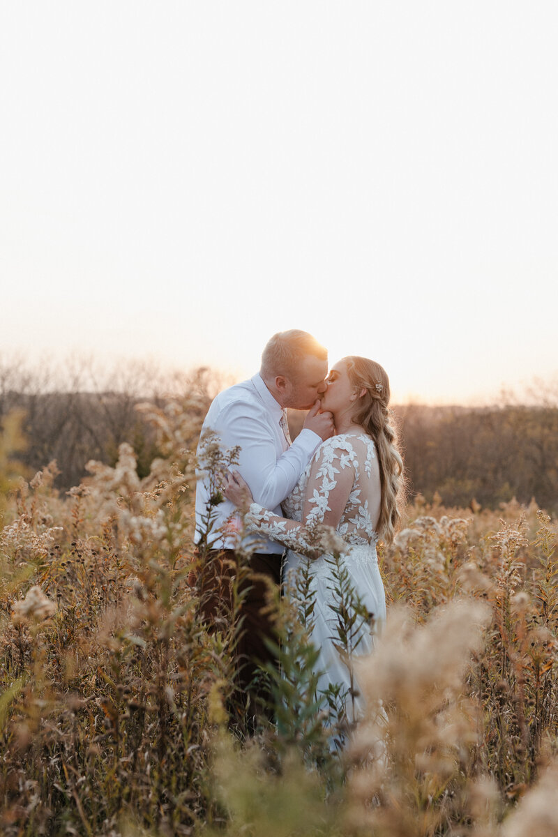 couple kissing during wedding photos in montana