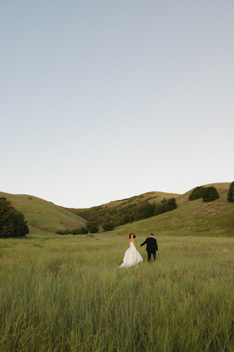 bride and groom holding each other during wedding