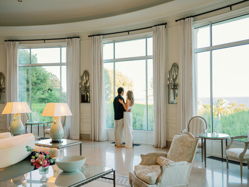 Couple in the main hall looking at the view (Four Seasons Cap-Ferrat)