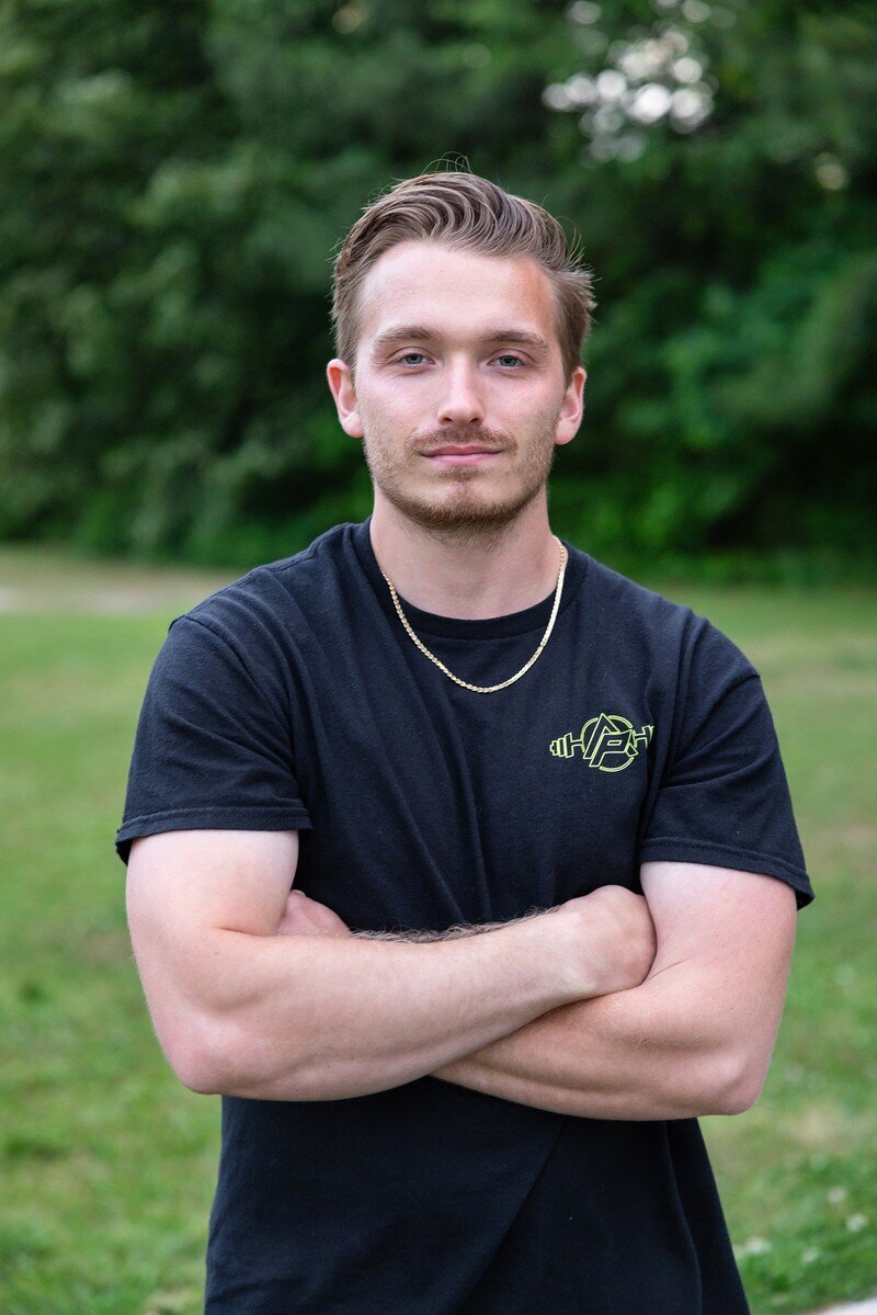 Image of personal fitness trainer sitting on road
