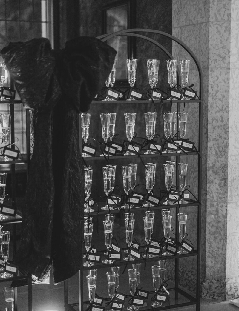 Black glass shelf champagne wall