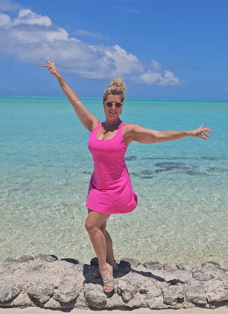 personal vacation planner agent GG Mack smiling on the beach