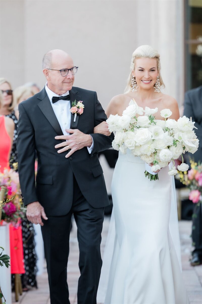 Bride walking down the aisle at the country club of Orlando.