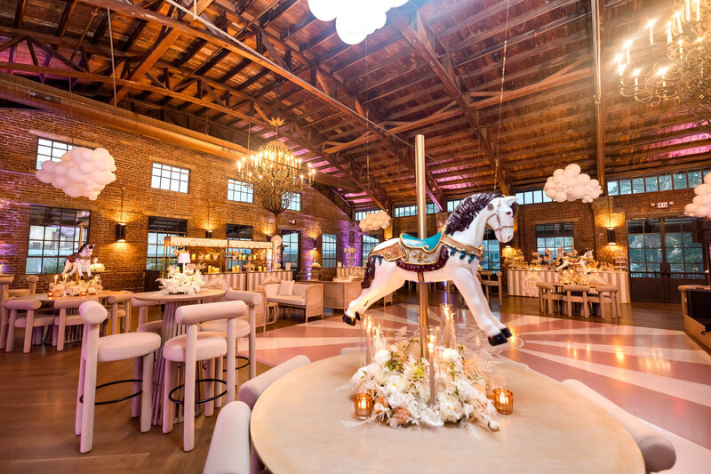 Carnival themed event with horse statues and beautiful decor