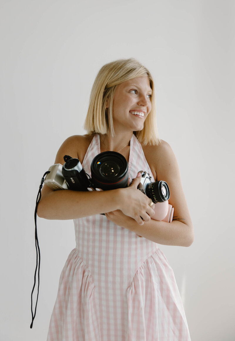 Indianapolis photographer smiling with camera

