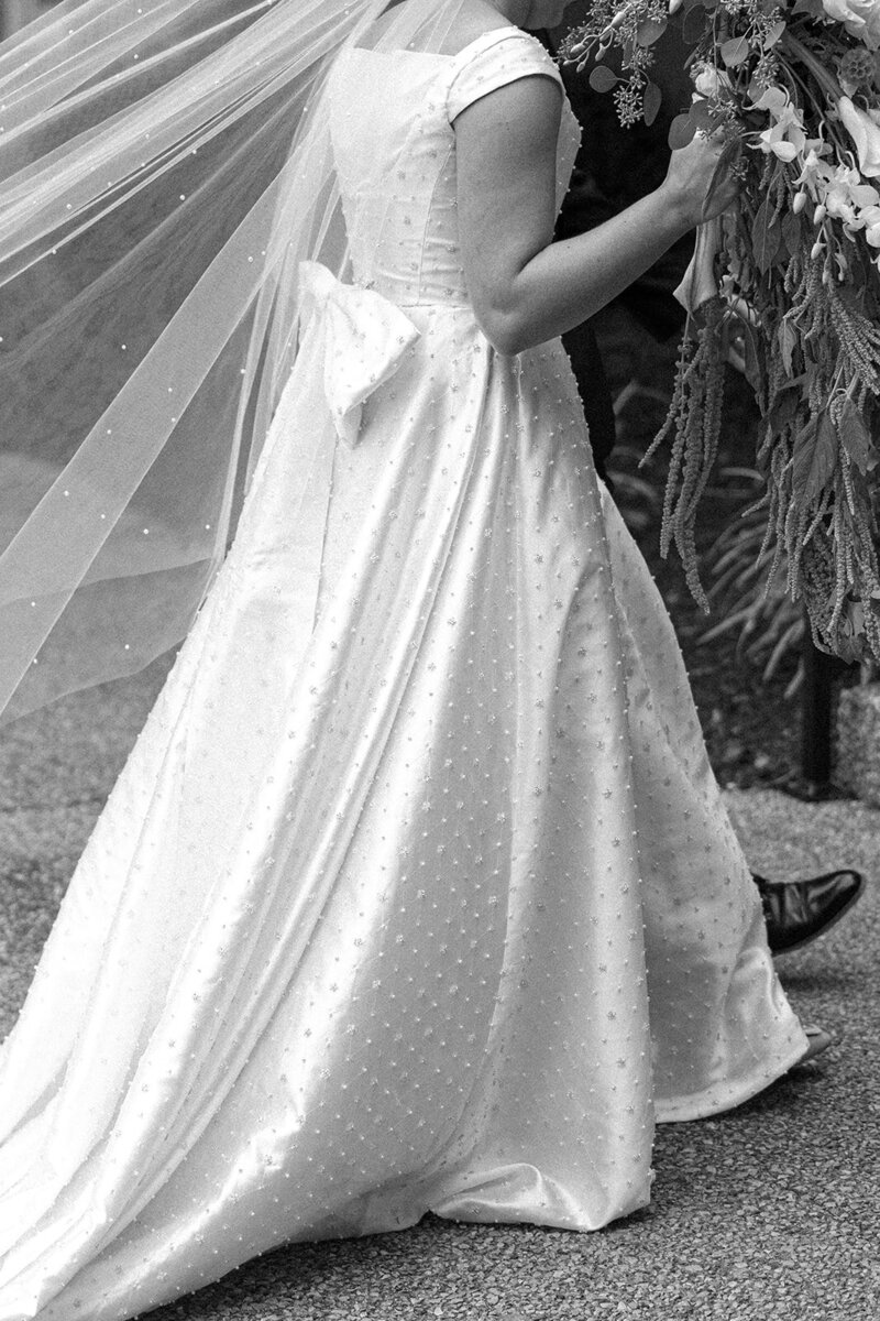 Close of up a bride's wedding gown that shows off the dress's beaded details