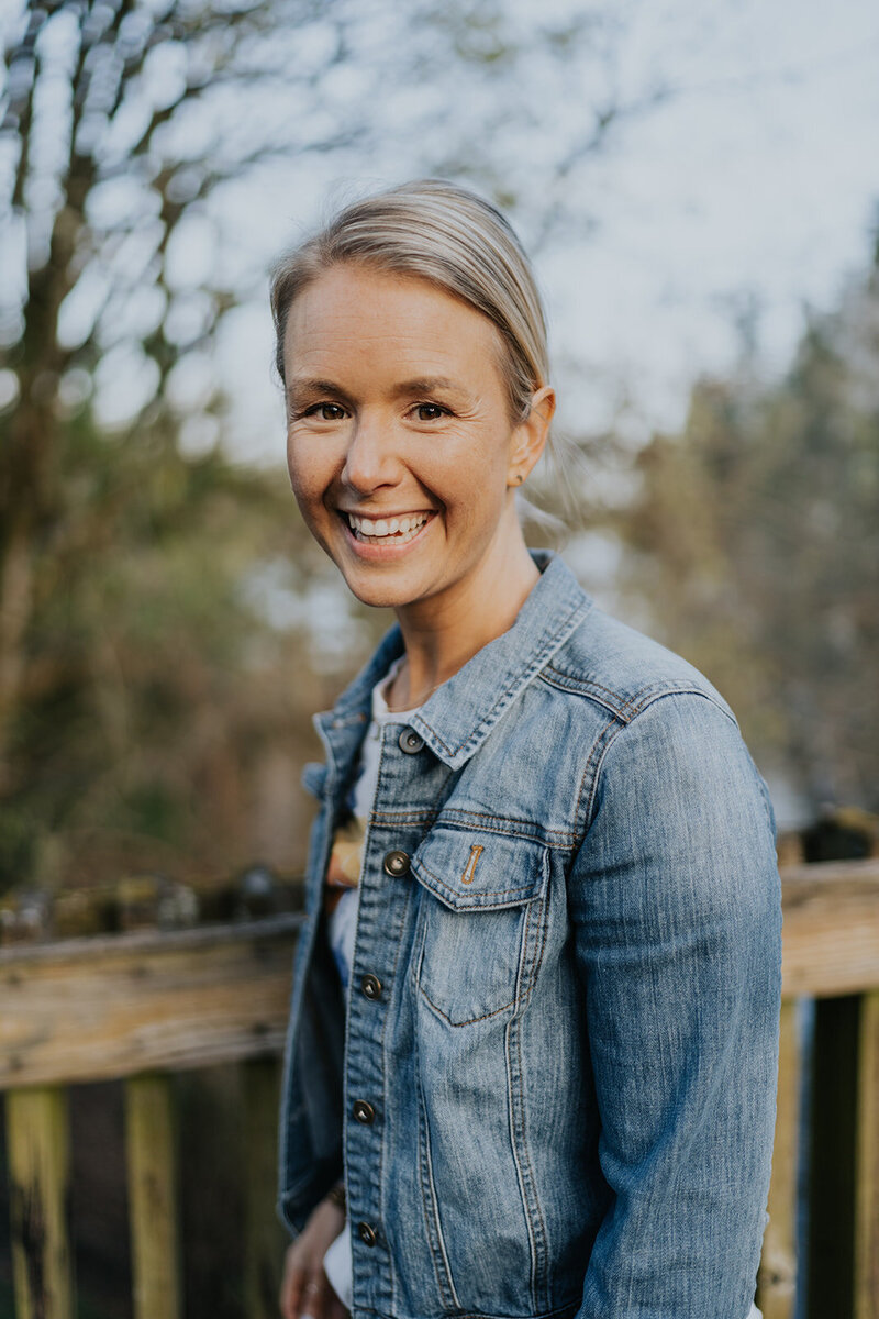 Women Smiling Wearing Denim Jacket in the Outdoors