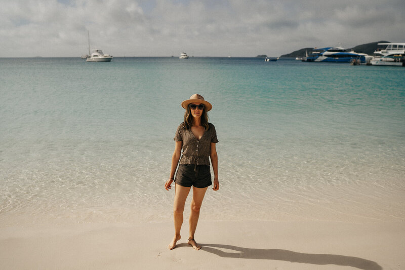 sarah godenzi standing at ricketts point beach