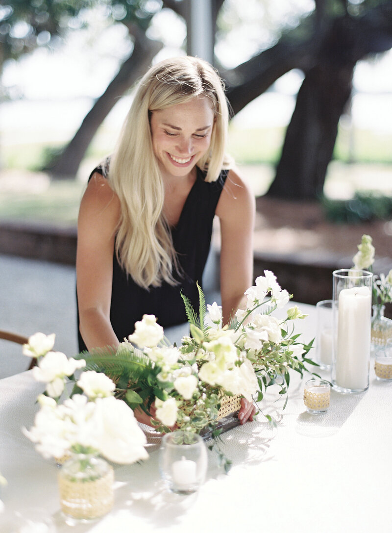 Emma Ivey Gowen standing on a cobblestone alley in historic downtown Charleston South Carolina