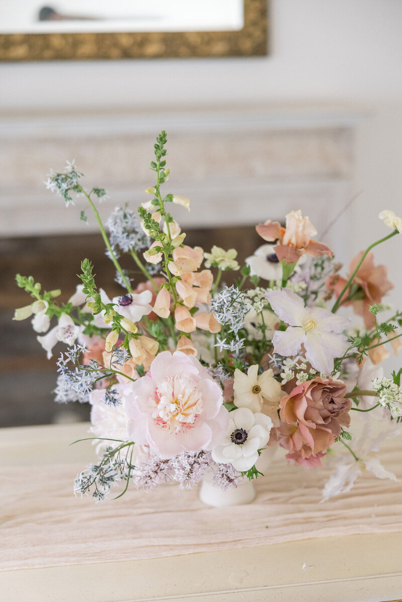 Flower arrangement with soft muted pastel spring flowers