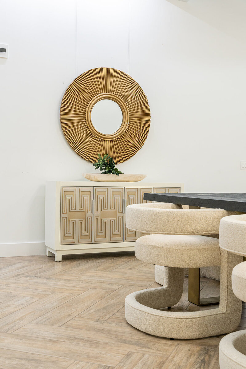 Console with mirror and round dining chairs