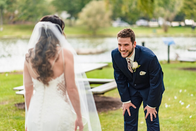 bride and groom first look in a park