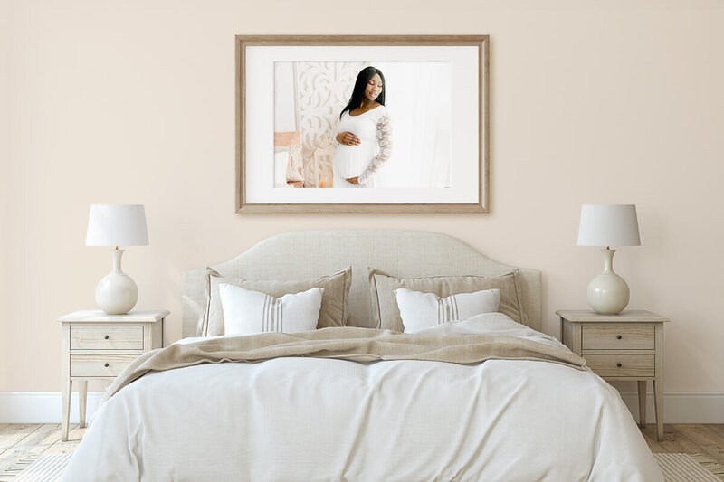 Maternity photo hanging on the wall of a bedroom.