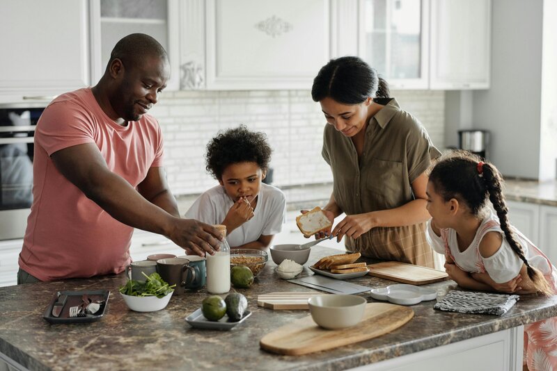 family making food in kitchen