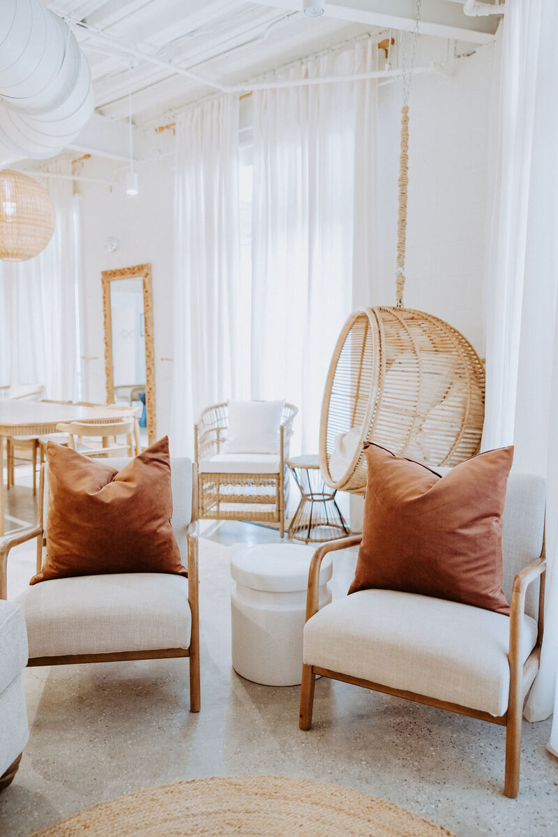 white chairs with orange pillows