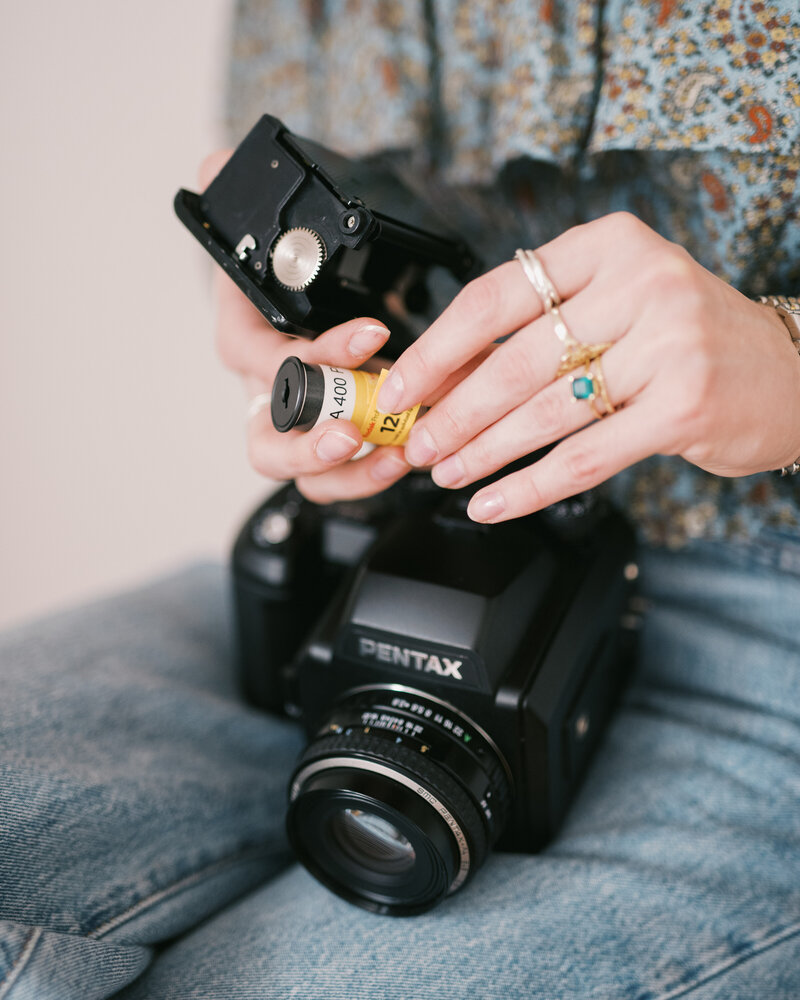 portra 400 120 film being loaded into medium format film camera by huntsville photographers