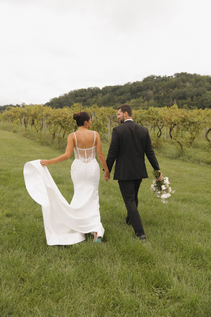 couple walking away after getting married 