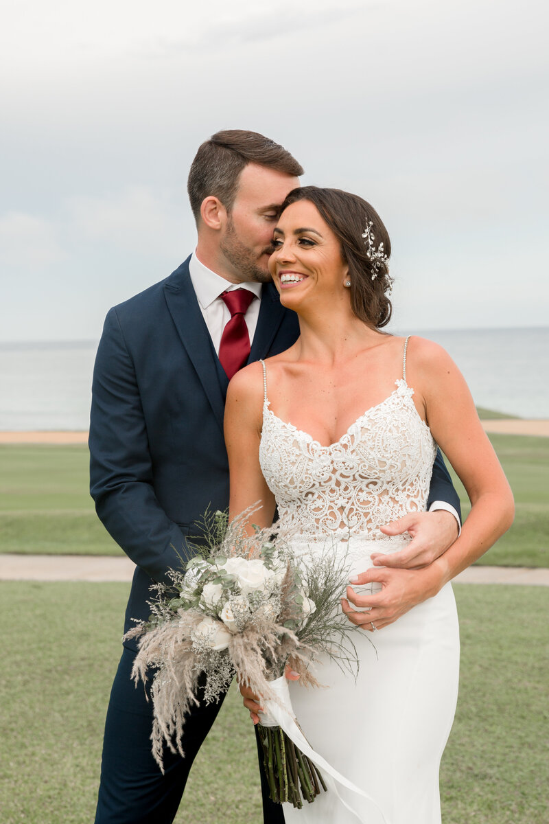 bride and groom embrace
