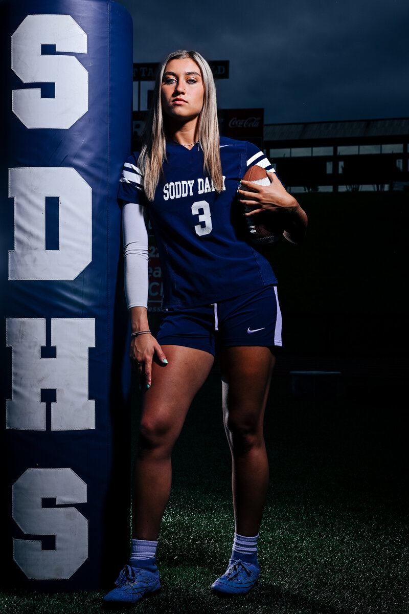 a flag football player takes her senior photos in chattanooga tn