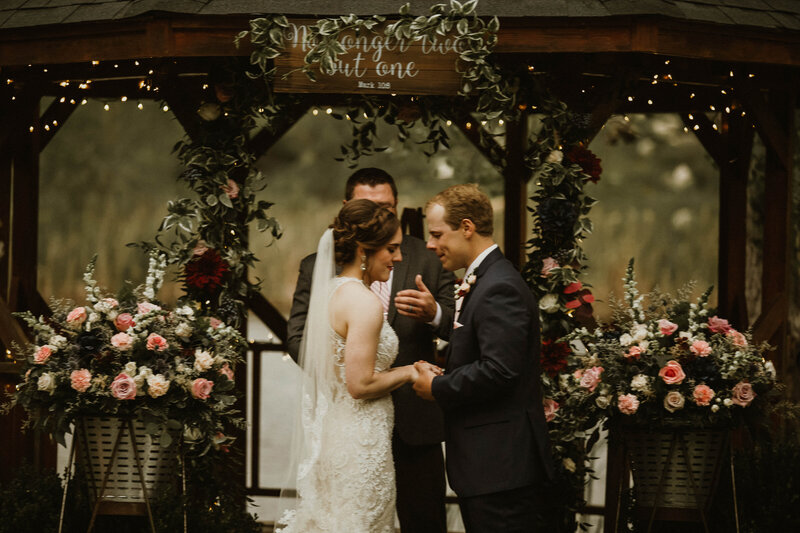 bride and groom praying during ceremony at the cove amarillo wedding venue