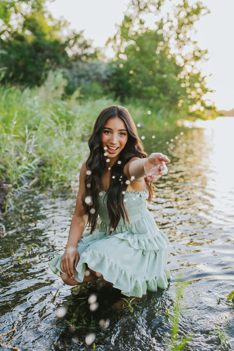 Graduation photo by senior portrait photographer outdoors