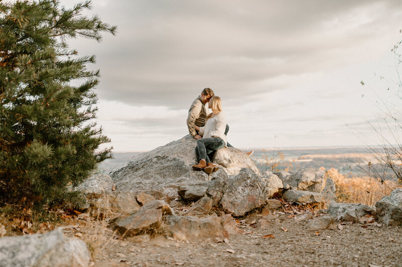 couple sitting on a rock