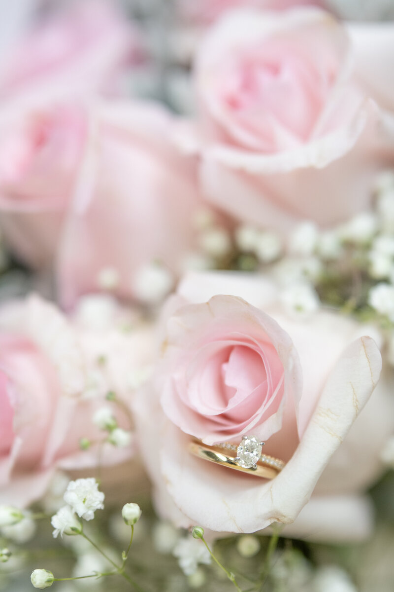 Wedding ring in pink roses