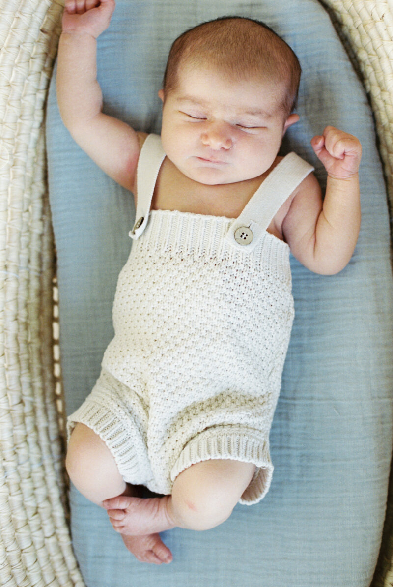 Newborn girl sleeping in her crib