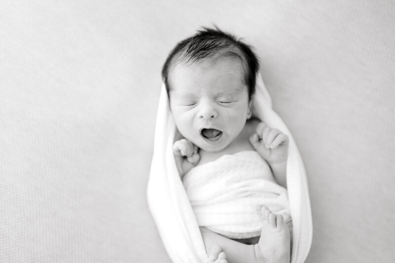 Black and white photo of Nashville newborn baby yawning