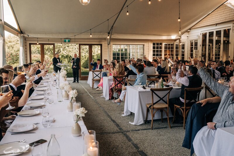 a wide shot showing the reception area of the winehouse queenstown with guests in it