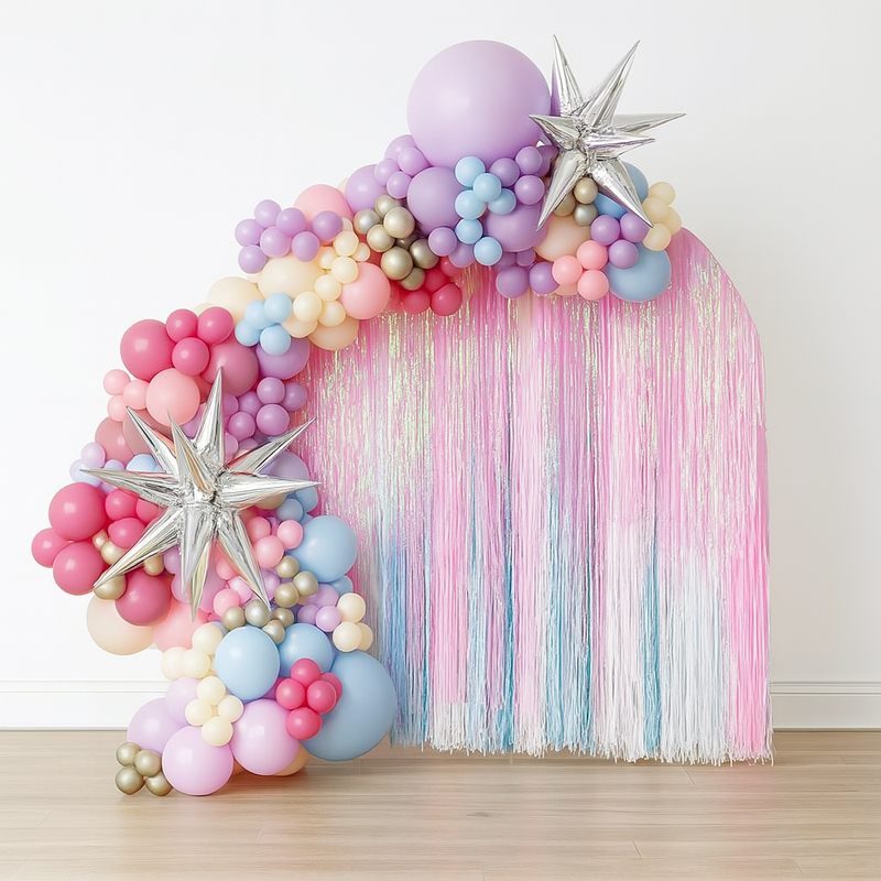 Fringe arch backdrop with balloon garland with starbursts