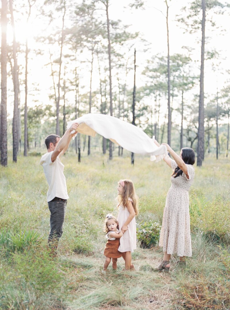 family playing together in nature. Orlando family photographers.