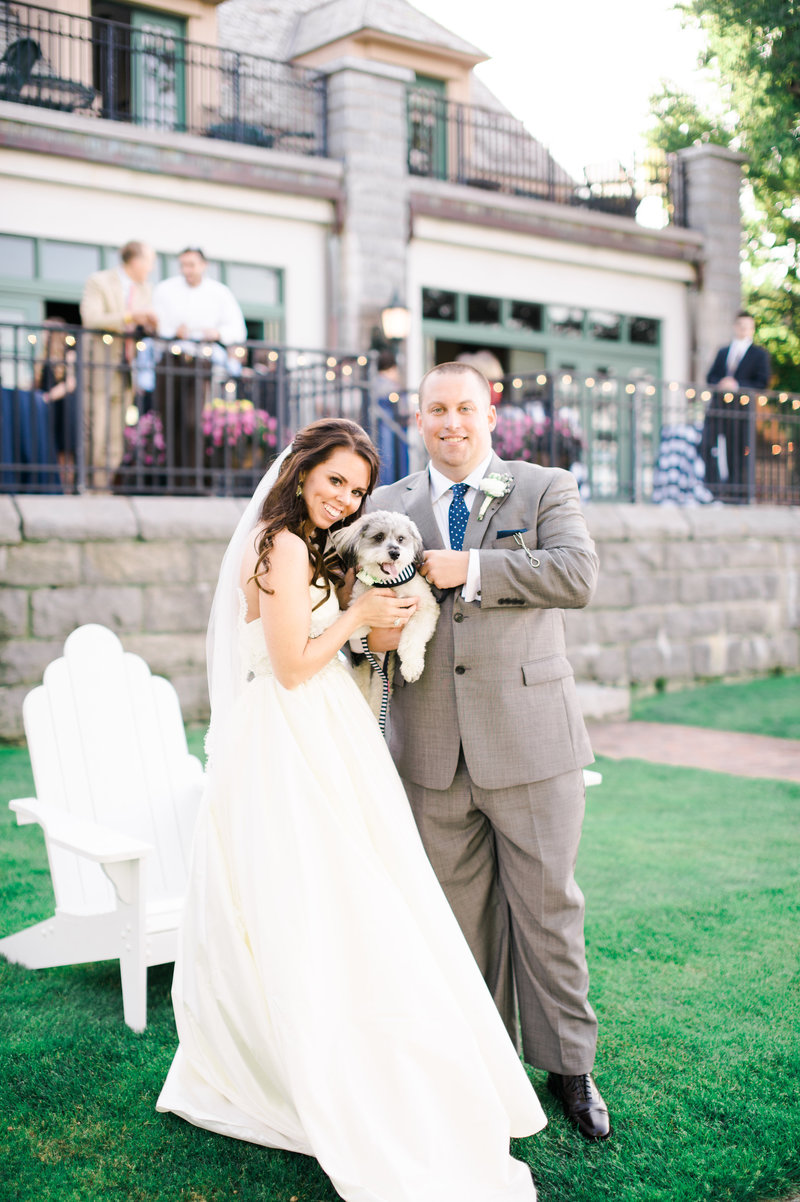Bride and groom with a dog