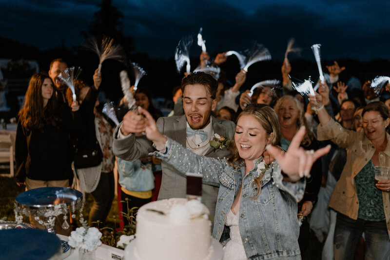 groom dipping the bride in the middle of the aisle