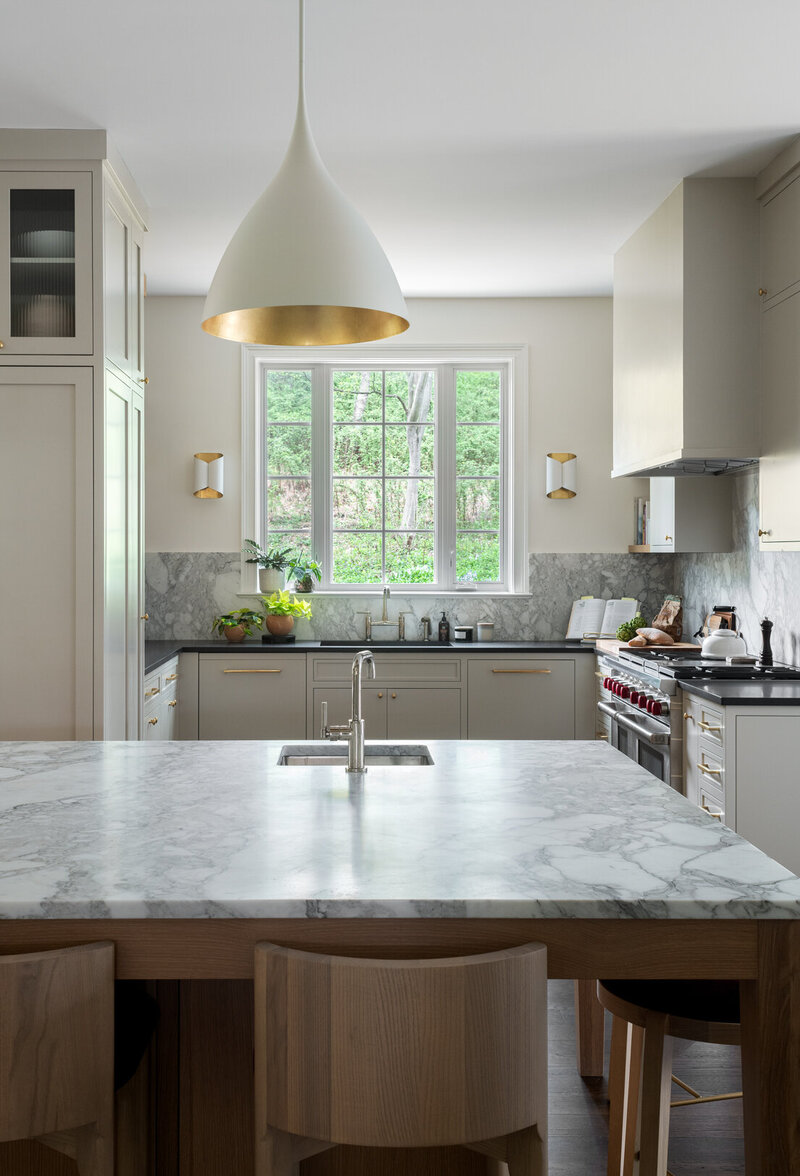 neutral colored tan kitchen with gold and dark wood accents