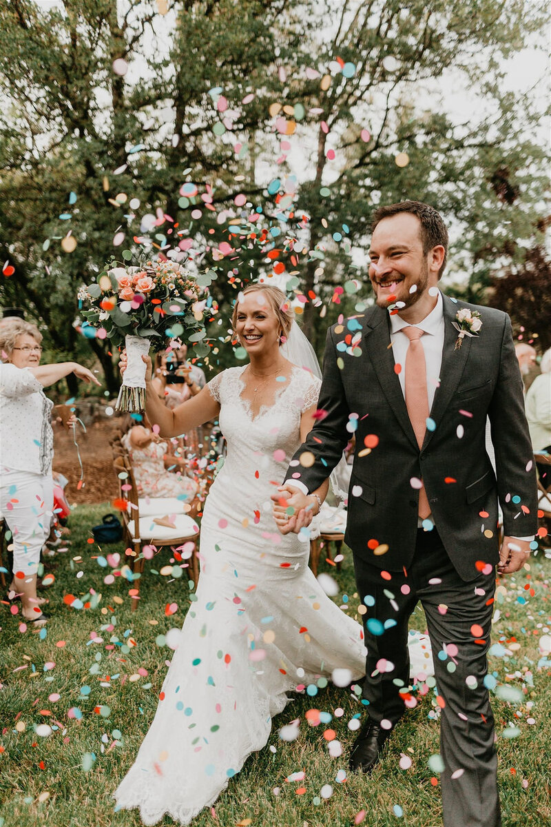 bride and groom leaving wedding ceremony