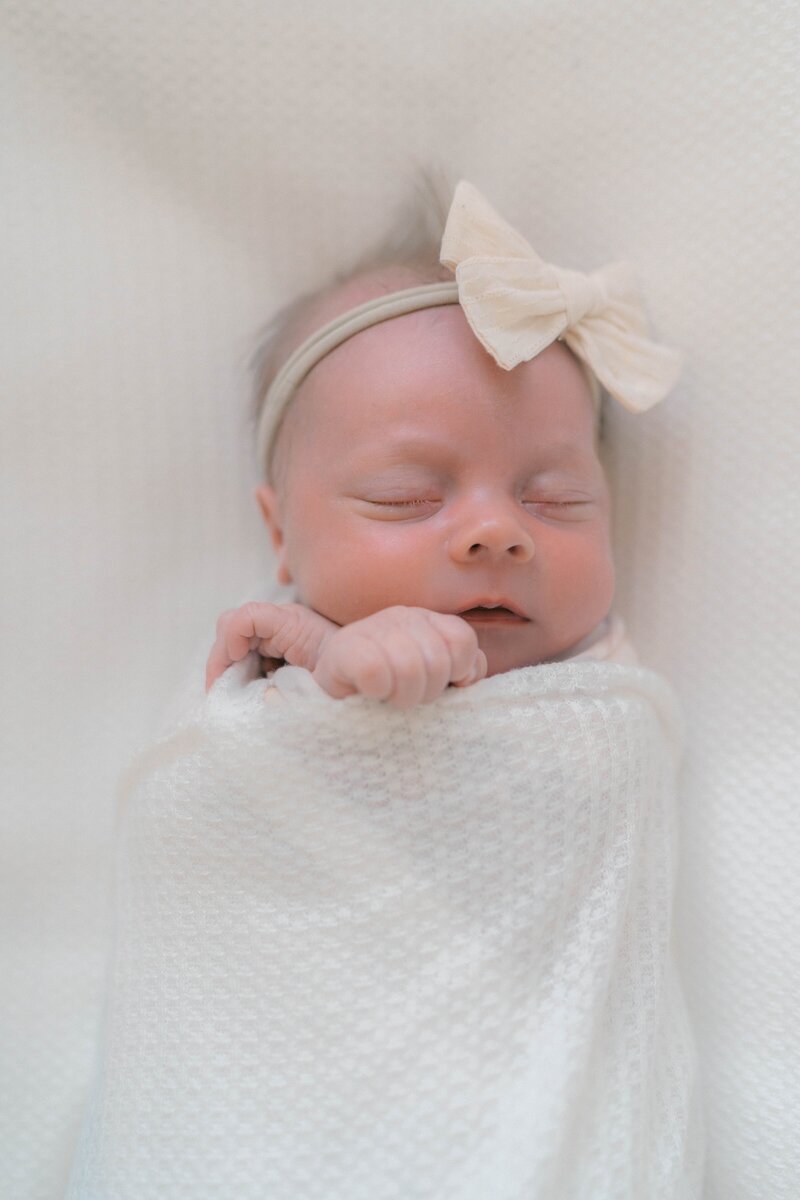 White nursery filled with natural light—newborn photography Salt Lake City style at its softest.