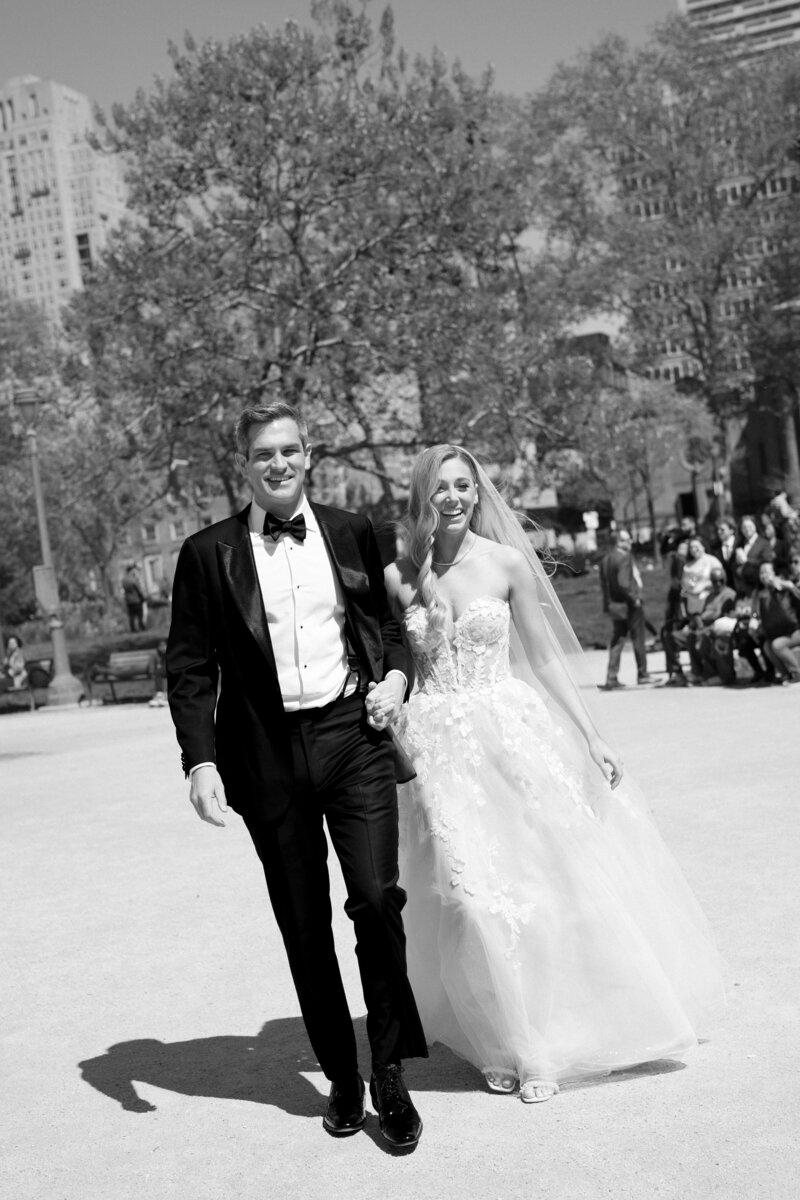 bride and groom walking in logan square, philadelphia
