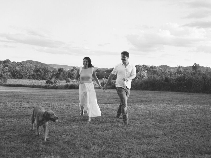 A bride and a groom holding hands smiling walking out of their cathedral wedding venue in Nashville, Tennessee.