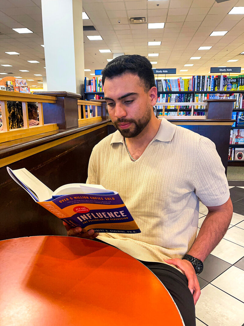Adrian Esparza reading book