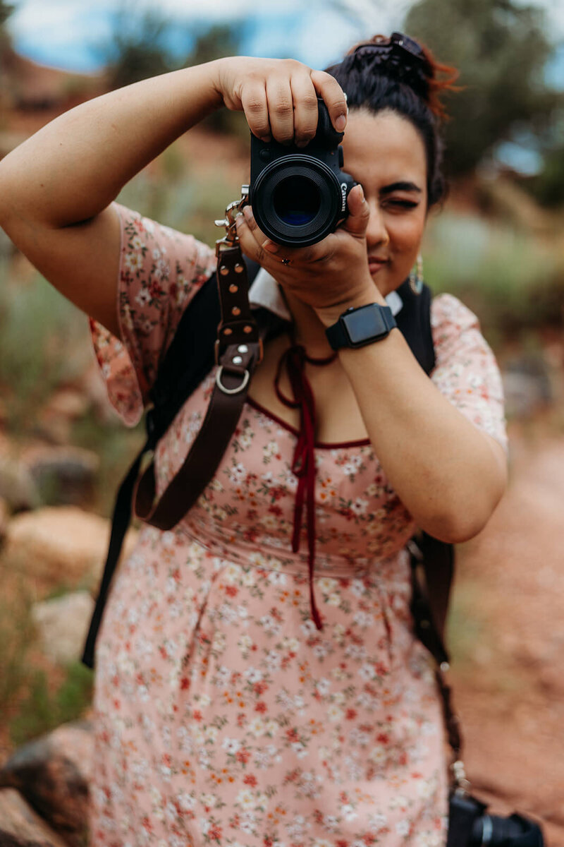 Photographer, Fatima Izzat, takes a photograph